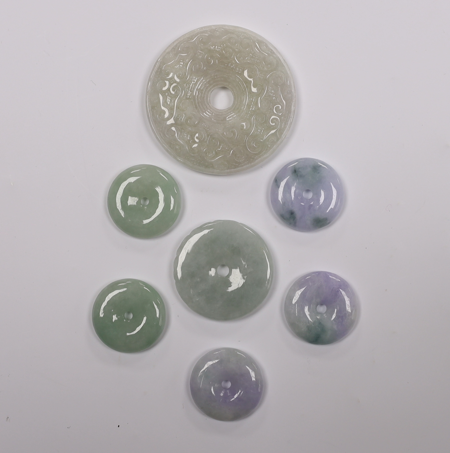 Seven Chinese carved jadeite bi discs